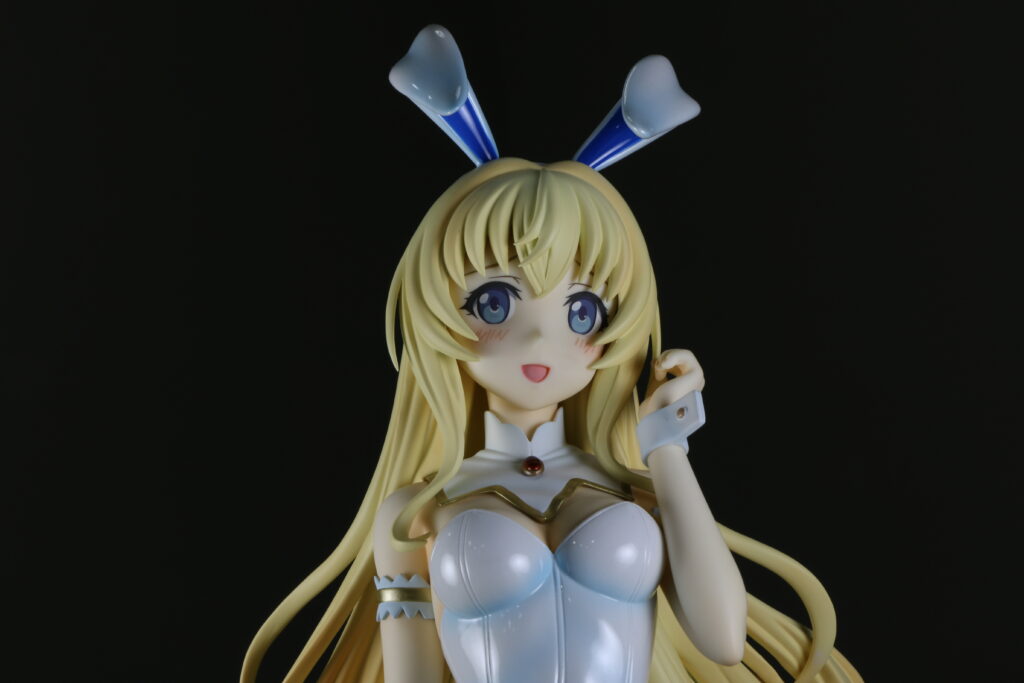 A photo of Priestess from the front, where we can see her curved bunny ears and her soft expression.